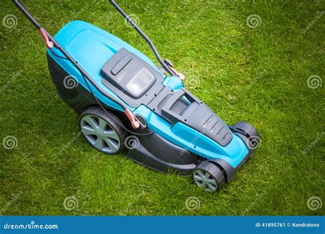 Blue Lawn Mower On Green Grass Stock Image Image Of Field Lawn 41895761