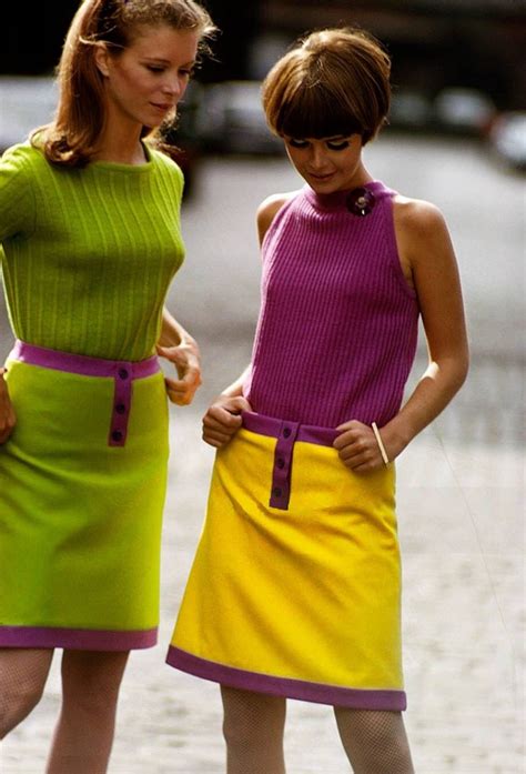 Two Unidentified Models One In A Green Sweater And Green Skirt And The