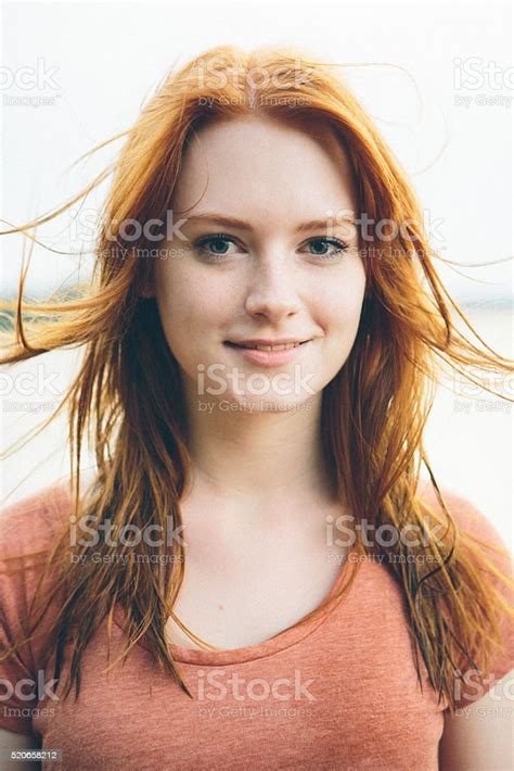 Portrait Smiling Young Redhead Woman On Nature Background Stock Photo