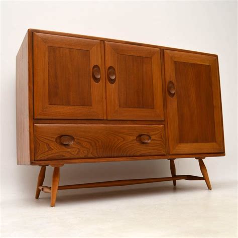 This is the classic family dining table from the 60s. 1960's Vintage Ercol Sideboard in Solid Elm ...