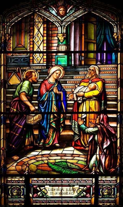 A Stained Glass Window With Three People Standing In Front Of It And