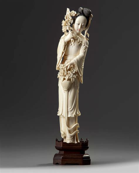 A Chinese Ivory Carving Of A Lady Holding A Flower Basket Oaa