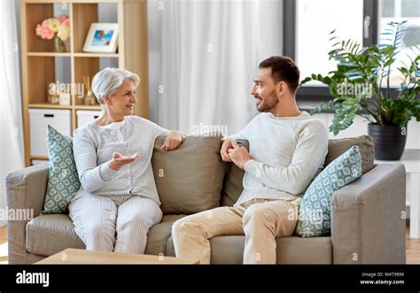 Senior Mother Talking To Adult Son At Home Stock Photo Alamy