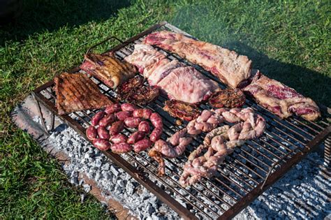 Various Meats Grilling For Traditional Argentine Asado Stock Photo