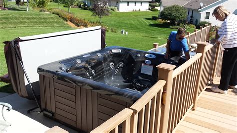 Thinking of installing an indoor hot tub? Here is a Master Spas Twilight Series installed next to a ...