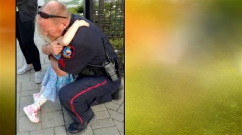 dad captures powerful photo of daughter hugging police officer