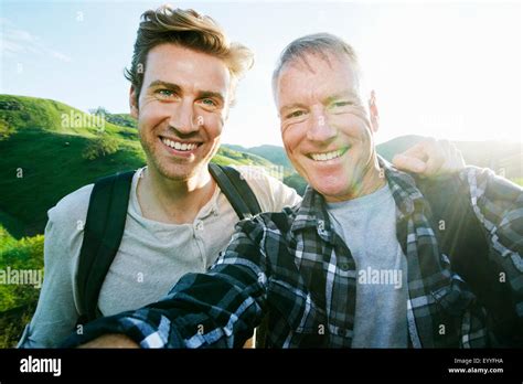 Caucasian Father And Son Taking Selfie On Rural Hilltop Stock Photo Alamy