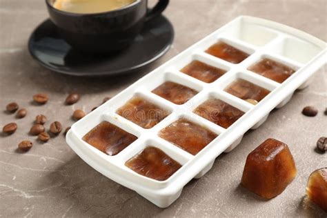 Ice Cubes And Coffee Beans On Grey Table Stock Image Image Of Cold
