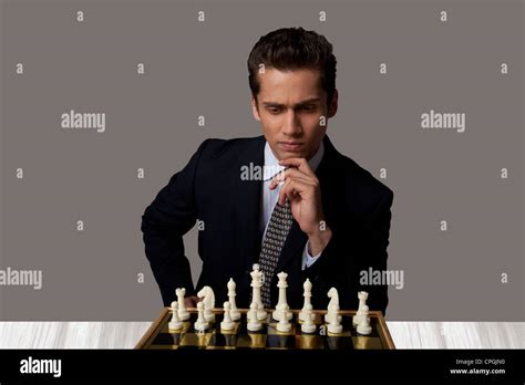 Businessman Playing Chess Stock Photo Alamy