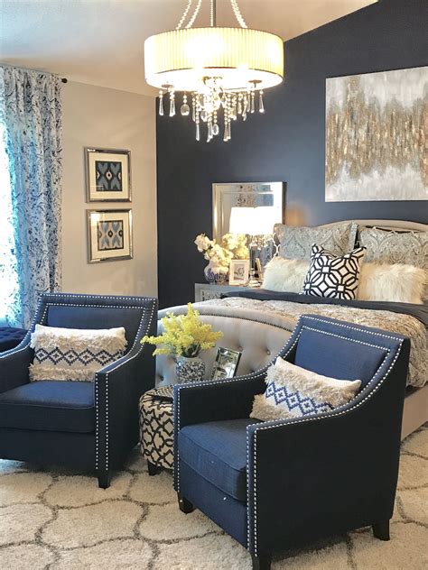 Give your bed a glamorous feel by decorating with sparkly blue, black and silver pillows that feature bright patterns and images. Yellow Door Interior: Navy and Grey Master Bedroom Decor ...