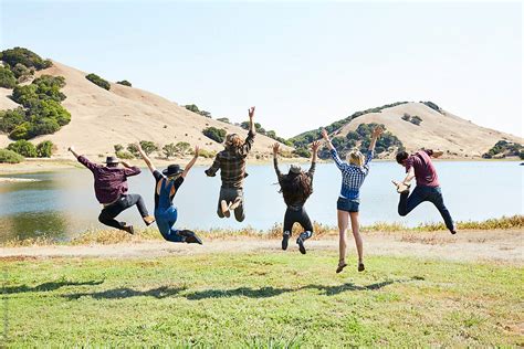 Group Of Friends Jumping In The Air By Stocksy Contributor Trinette