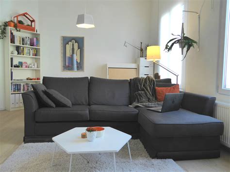 A Charcoal Gray Sofa Anchors The Large Living Space And Provides A