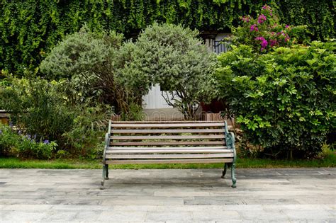 See more ideas about garden, garden bench, outdoor gardens. Classic Garden bench stock image. Image of brown ...
