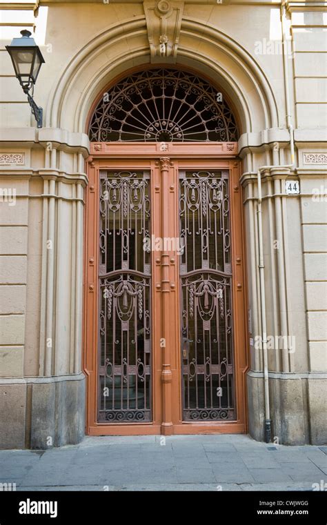 Huge Front Door With Wrought Iron Of Apartment Building In Barcelona