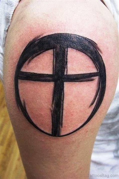 A tribal cross tattoo is a bold statement that blends religion and heritage. 70 Adorable Cross Tattoos On Shoulder