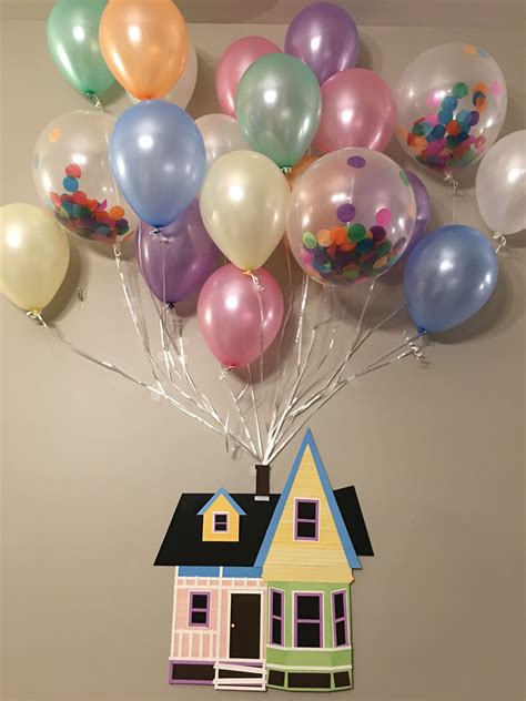 A House With Many Balloons Attached To Its Roof And On The Wall Above It