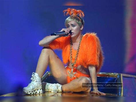 Miley Cyrus Flaunts Raunchy Images English Movie News Times Of India