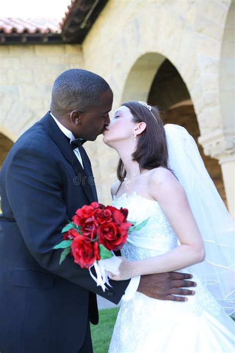 Interracial Wedding Couple Kissing Stock Image Image Of Groom Couple