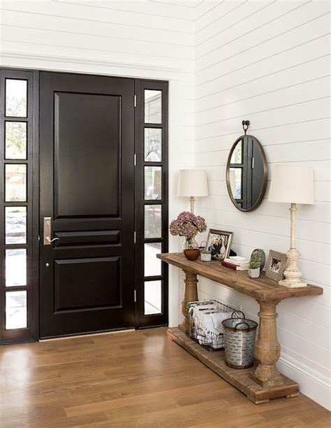 Does anyone have experience staining a door black? Ebony and ivory, shiplap and sidelights. There's so much ...