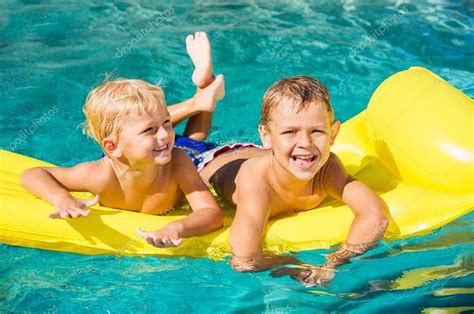 Kids Enjoying Summer Day at the Pool — Stock Photo © EpicStockMedia #59845921