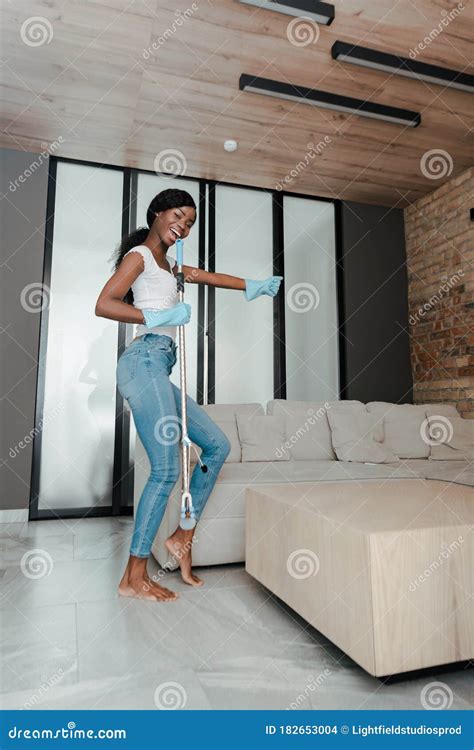 Happy African American Woman With Outstretched Hand Smiling Singing