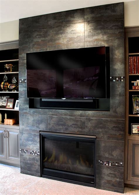 decoratives can be used for more than just backsplashes adding them to a fireplace showcases