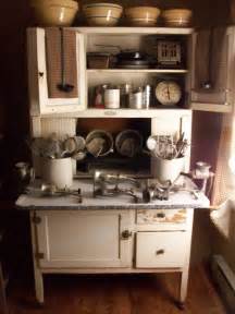 Beautiful old oak hoosier cabinet complete with flour sifter/bin on right side. Hoosier Cabinet with great collection of yellow ware and ...
