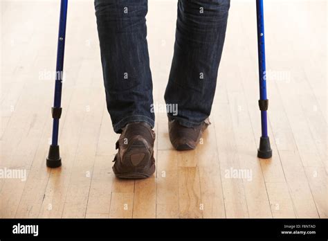 Close Up Of Man Using Crutches Stock Photo Alamy