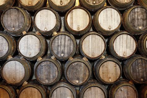 Stacked Oak Barrels In A Winery Photograph By Marc Volk