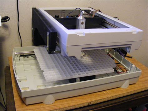 It is not a laser cutter/engraver, but could be converted to one if you want. DIY Laser Cutter | Flickr - Photo Sharing!