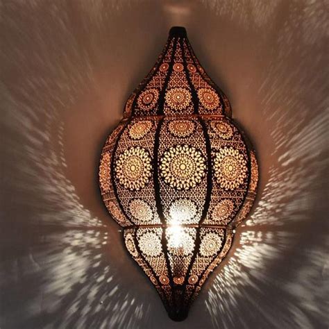 Transform your walls into works of art and light up your space with our wall lamps. Black oriental wall lamp with warm copper finish inside ...