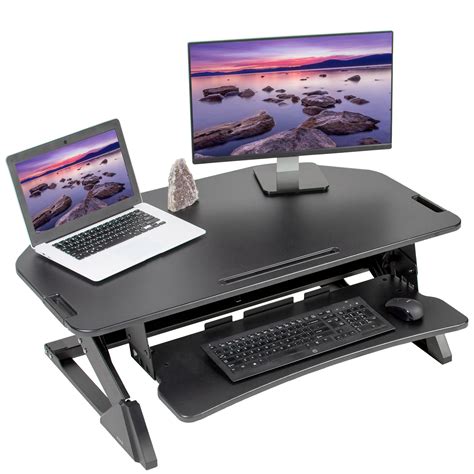 Standing desk is basically a desk that allows you to stand up and work without straining your hands and legs. VIVO Black Corner Height Adjustable Dual Tier Stand up ...