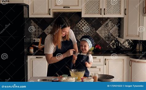 Mom And Daughter Having Fun With Flour In Kitchen Mother Smears Daughter Face Stock Video