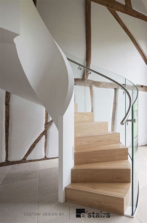 Interior designer ken gemes dresses this handsome staircase in an inky and elegant runner rug. Helical Stair by EeStairs | Staircase design, Circular stairs, Stair design architecture
