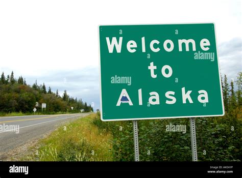 Welcome Sign At Alaska Highway Stock Photos And Welcome Sign At Alaska