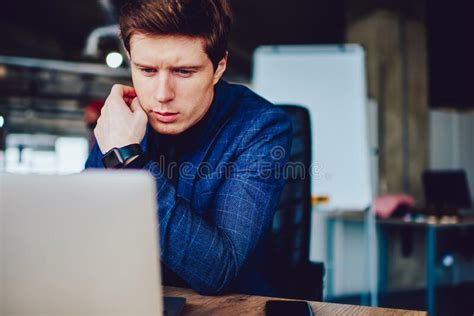 Caucasian Male Colleague In Formal Suit Working With Laptop Computer In