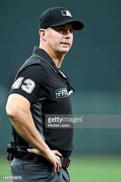 Umpire Shane Livensparger Looks On During A Baseball Game Between The