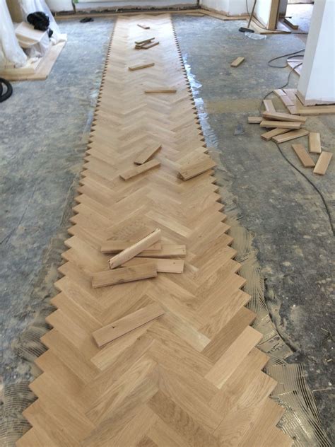 Starting In The Centre Of The Floor To Lay The Oak Herringbone Pattern