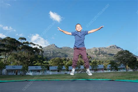 Boy Jumping On Trampoline Outdoors Stock Image F0147936 Science