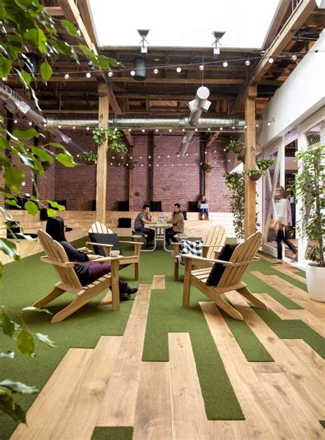 An Indoor Area With Chairs Tables And Plants