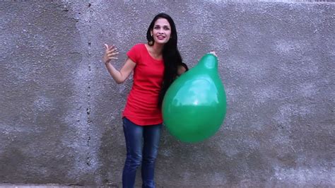 she blows and pops balloons bigger than her youtube