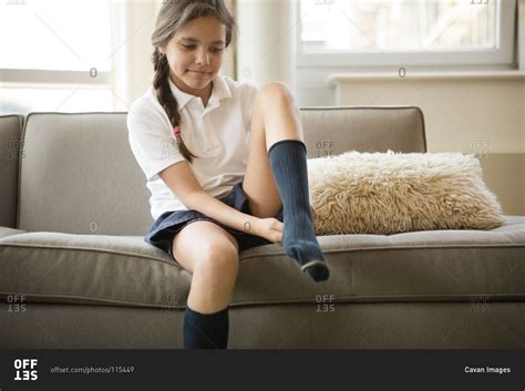 Girl Putting On A Sock Stock Photo Offset