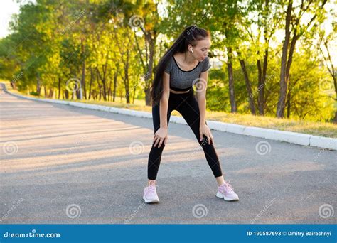 fitness woman tired jogger breathing after run marathon in park stock image image of jogger
