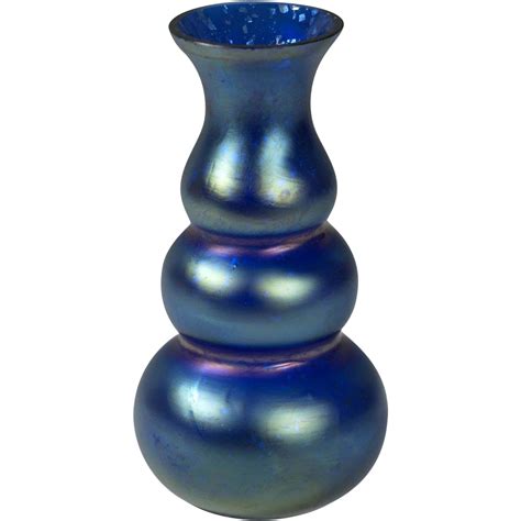 loetz blue iridescent art deco ball vase from glasscollectordotnet on ruby lane