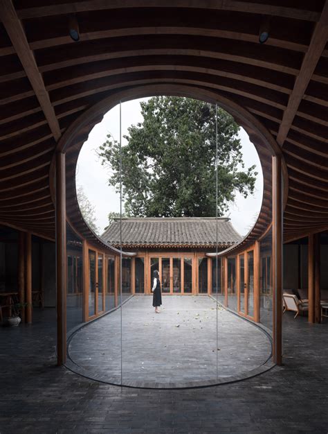 Curving Glass Walls Transform Restored Qishe Courtyard In Beijing In