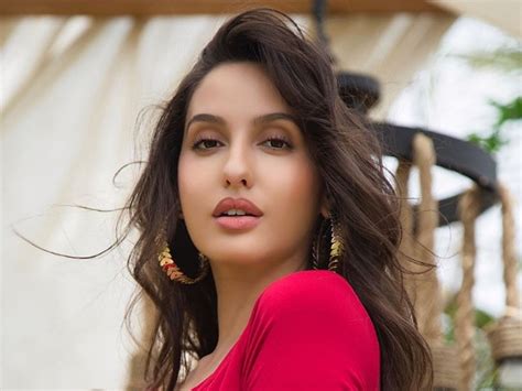Bhuj Actress Nora Fatehi Rocks Her All Purple Look In Her Latest