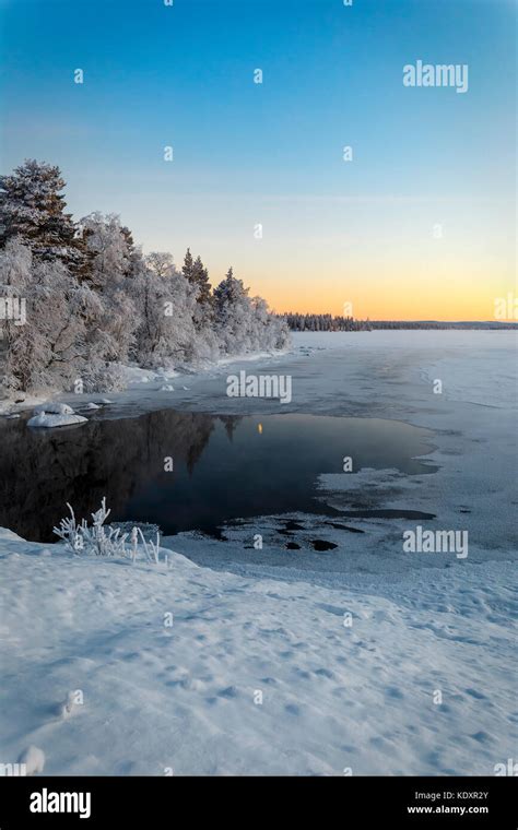 Winter Lake In Finland At Sunset Stock Photo Alamy