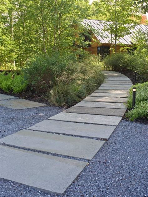 Monolithic Ledge Stone Panels Are Set Into The Stone Dust As Part Of