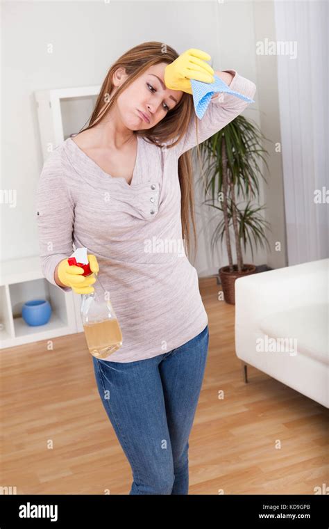 Portrait Of Young Woman Doing Household Chores Stock Photo Alamy