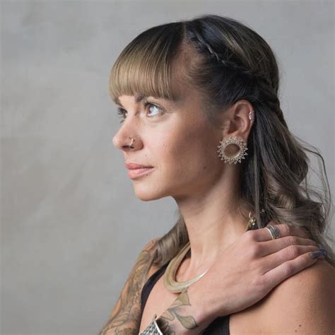 woman wearing tribalik ear tunnel jewellery cute ear piercings stretched ears ear tunnels